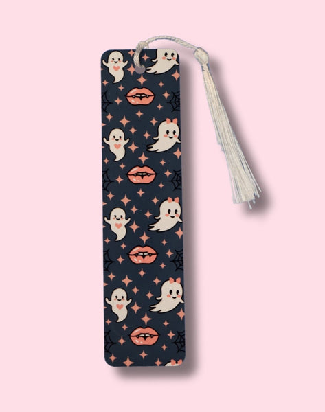 Patterned bookmark with ghost and vampire lips design on a pink background