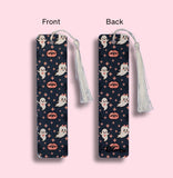 Halloween-themed bookmark with tassel on a pink background