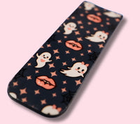 Magnetic bookmark with ghost and lip pattern on a pink background