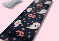 Navy bookmark with ghost and vampire lips pattern on a pink background