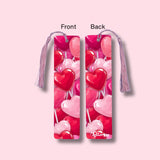 Heart-shaped lollipop design bookmark with tassel on a pink background