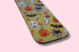 magnetic bookmark with Halloween-themed design on a pink background