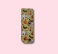 magnetic bookmark with Halloween-themed design on a pink background