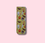 magnetic bookmark with Halloween-themed design on a pink background