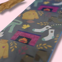 Colorful patterned bookmark on a pink background