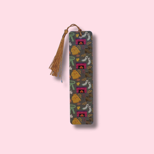 Decorative bookmark with tassel on a pink background