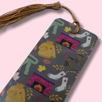 Colorful bookmark with tassel on a pink background