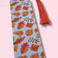 Bookmark with autumn leaf pattern on a light blue background