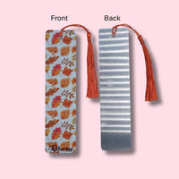 Autumn Leaves bookmarks with tassels on a pink background