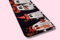 bookmark with cartoon ghosts character design on a light pink background
