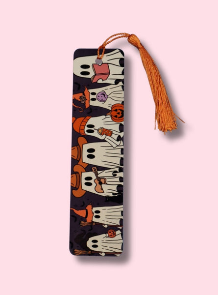 Decorative bookmark with tassel on a pink background