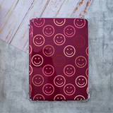 Kindle Case with Smiley Faces decals with pink and nude color hues