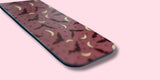 Purple magnetic bookmark with bats and crescent pattern on a pink background