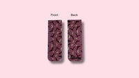 Patterned product packaging showing front and back views on a pink background