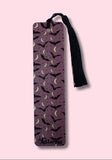 Purple bookmark featuring Bats and crescent moons with a black tassel on a pink background