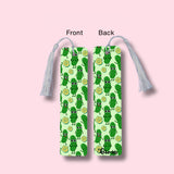 Two bookmarks with pickle design on a pink background