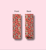 front and back side of bookmark with ghost pattern, one showing front and the other back, on a pink background.