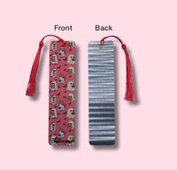 Bookmarks showing the front and back designs on a pink background