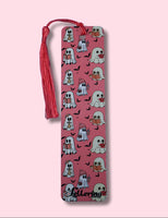 Pink bookmark with ghost pattern and tassel on a pink background