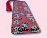 Pink bookmark with ghost designs and  A Lettering Story logo on a pink background