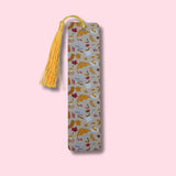 Fall Themed bookmark with tassel on a pink background