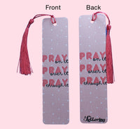 The Front and Back of the bookmark with salmon color tassels, the front and back of the bookmark shows the quote 'Pray on it, Pray over it, Pray through it" with the back side of the bookmark with the brand name "A Lettering Store", on a pink background.