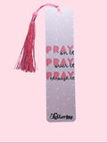 Pink Bookmark with quote "Pray on it, Pray over it, Pray through it" and salmon-color tassel on a pink background