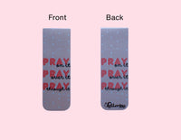 Front and back of pink magentic bookmark with quote "Pray on it, Pray over it, Pray through it" on front and back of bookmark on a pink background