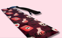 bookmark with colorful skulls and potion bottles pattern on a pink background