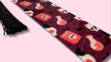bookmark with Halloween-themed pattern on a pink background