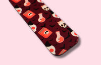 Patterned bookmark on a pink background