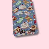 Bookmark with winter-themed design on a pink background