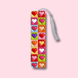 Colorful heart design bookmark with tassel on a pink background