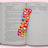 Colorful heart design bookmarks on an open book