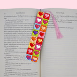 Colorful heart-shaped bookmark on an open book