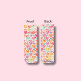 Colorful heart-patterned magnetic bookmark with 'A Lettering Story' branding on a pink background